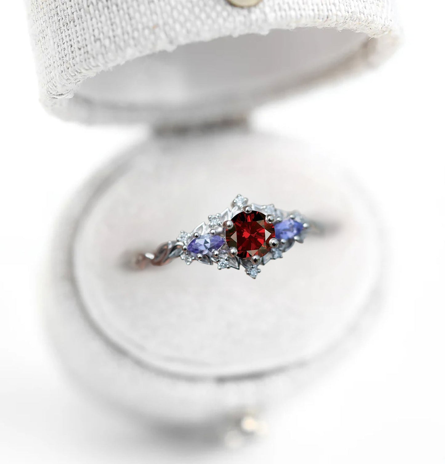 Unique Celeste Rose Three-Stone Round Garnet Anniversary Ring