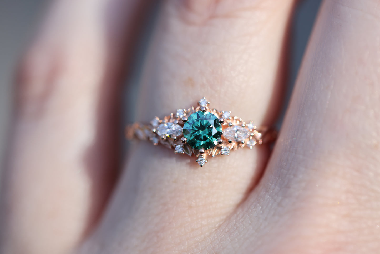 Unique Celeste Rose Three Stone Round Teal Moissanite Ring