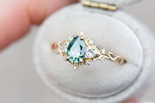 Unique Celeste Rose Three Stone Pear Teal Moissanite Ring